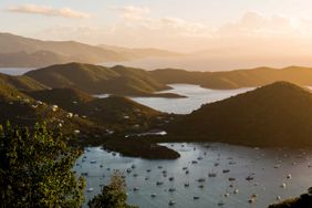 The sun sets over Sanders Bay and Coral Bay on St. John