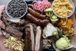 Plate of barbecue meats and sides from La Barbecue