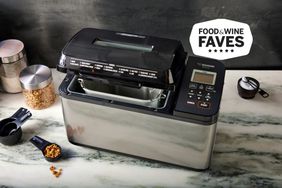 Zojirushi Home Bakery Virtuoso Plus Bread Maker displayed on marble countertop