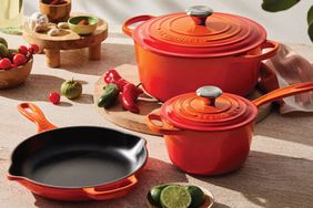 A variety of Le Creuset pots and pans on a kitchen counter