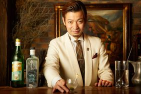 A bartender serving a drink at Bar Benfiddich 