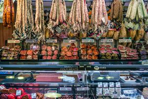 A meat counter with aged meats at La Boqueria market in Barcelona