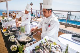 Chefs cooking on a Viking cruise ship