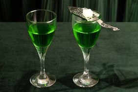 Glasses of absinthe served with a sugar cube