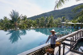 A serve delivers poolside corn at Intercontinental Da Nang