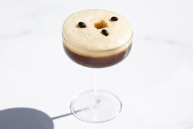 SoufflÃ© Espresso Martini in a coupe glass against a white background.