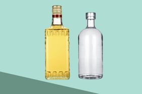 A bottle of tequila and vodka side by side