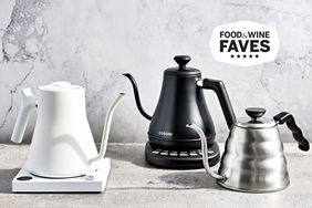 Three Gooseneck Kettles we recommend on a marble background